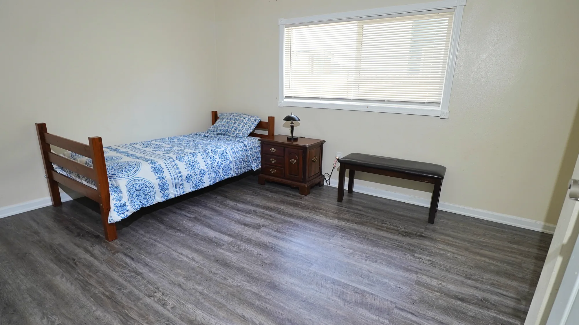 Resident bedroom with bench